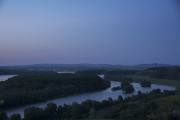 Blue hour over forest surrounded by rivers