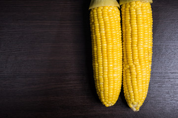 Corn on wood background.