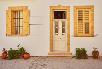 yellow shutters window and door