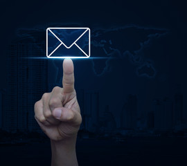 Hand pressing mail flat icon over world map and modern city tower, Contact us concept, Elements of this image furnished by NASA