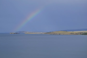 View from Shaman Rock on the Baikal lake with rainbow