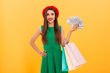 Cheerful young woman standing isolated