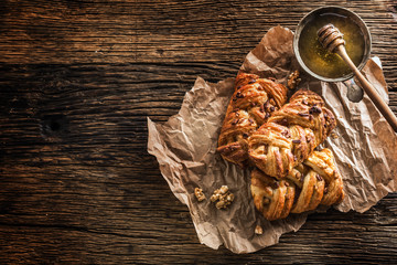 Sweet Pastry. Sweet pie honey cup of coffee on wooden table. Sweet breakfast