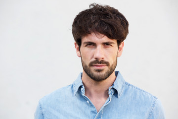 Obraz premium handsome young man with beard against white background