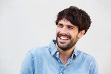 smiling man with beard against white background