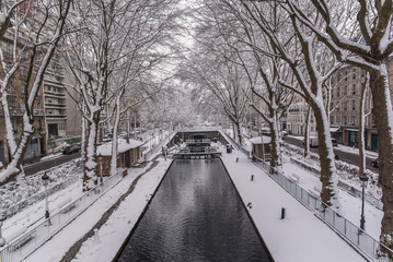 Paris, canal Saint-Martin under the snow, the quay in winter 
