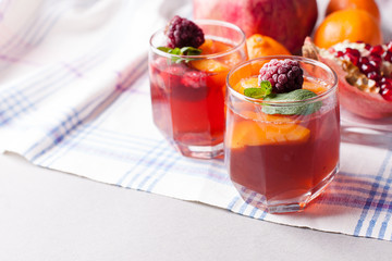 portioned fruit dessert in glass cups kremankah - jelly with fruit and mint, low-calorie summer snack