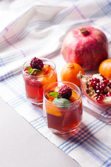 portioned fruit dessert in glass cups kremankah - jelly with fruit and mint, low-calorie summer snack
