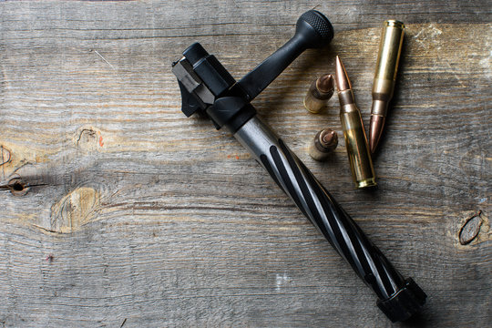 Shutter and ammo, lies  and on a wooden background.