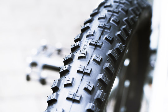 New And Clean Black Mountain Bike Rear Wheel Detail And 29 X 2,2 Tire Close Up, Abstract With White Background