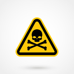 Single yellow triangular warning sign icon graphic of black skull and crossbones over isolated white background