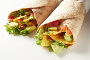 Mexican tortilla wraps with nachos and salad