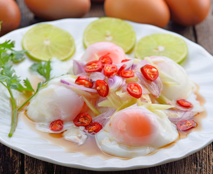 spicy boiled eggs on white plate