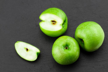 Green apples  on stone table. Top view with copy space