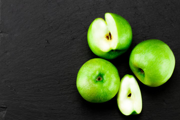 Green apples  on stone table. Top view with copy space