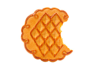 Bitten biscuit closeup on white background