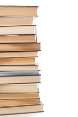 Stack of books close up on white background