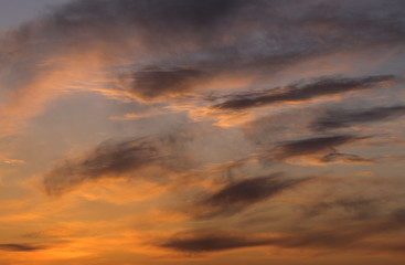 Beautiful colorful sky with clouds and sunlight. Color toned.
