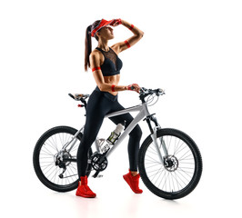 Naklejka na ściany i meble Sporty woman with bike looking into the distance in silhouette on white background. Sport and healthy lifestyle