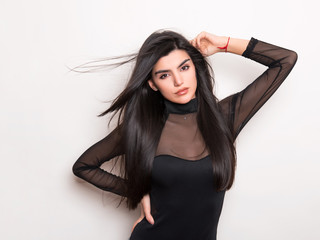 Fototapeta premium beautiful young woman with long black hair 
