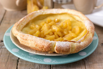 Dutch baby pancake with apple-cinnamon sauce.
