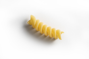 One piece of Fusillo pasta isolated on white background