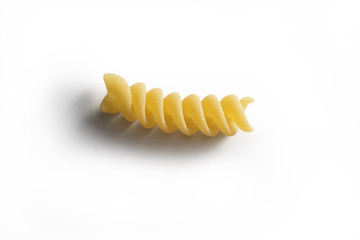 One piece of Fusillo pasta isolated on white background