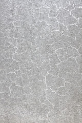background texture of a gray wall with cracks