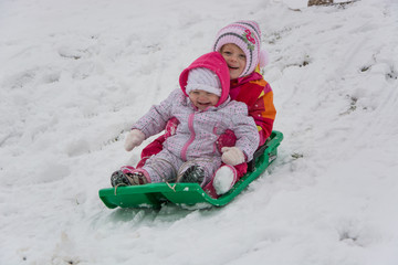 Child sisters playing in winter