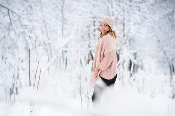 Beautiful woman enjoys the snow. A fabulous winter. Christmas holiday. All in the snow.
