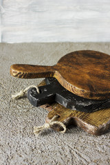 Wooden cutting boards on grey concrete background