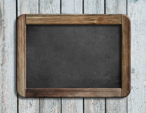 Aged blackboard hanging on white wooden wall 3d illustration