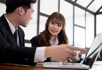 business people having a meeting. businessman & businesswoman working with financial chart report. startup man & freelance woman discussing market plan at workplace. discussion, teamwork, 