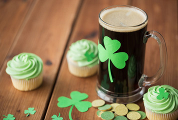 shamrock on glass of beer, green cupcakes and coins