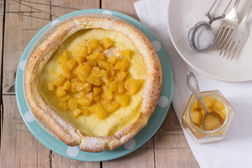 Dutch baby pancake with apple-cinnamon sauce.