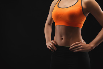 Fototapeta na wymiar Athletic woman showing muscular body
