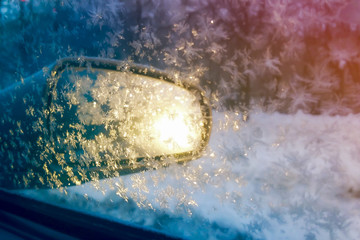 the glass of the car in snowflake, frost