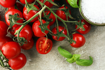 Ripe tasty red tomatoes with salt and basil. Village market organic tomatoes. Fresh tomato
