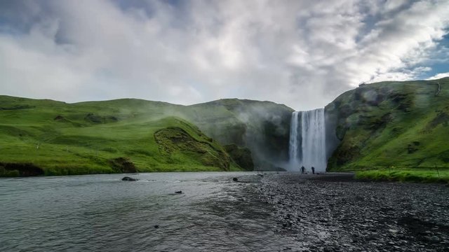 Morning sky over waterfall Skogafoss in Icelandic nature Time lapse