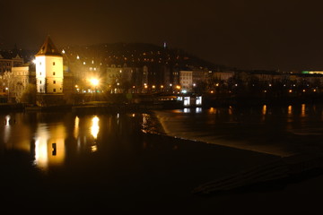 Fototapeta na wymiar Night Prague view. Vltava river, cityscape.