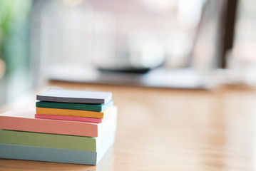 sticky note, notebook on wood desk at office workplace. business, workspace, education concept.