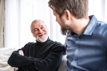 Fototapeta premium Hipster son and his senior father at home.