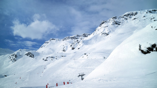 Panoramic alpine winter landscape of slopes, off piste skiing, chair lifts, in the highest French resort of Val Thorens, Les Trois Vallees .