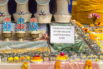 offerings of butter and flour at the Mahabodhi Temple, Bodhgaya, Bihar, India