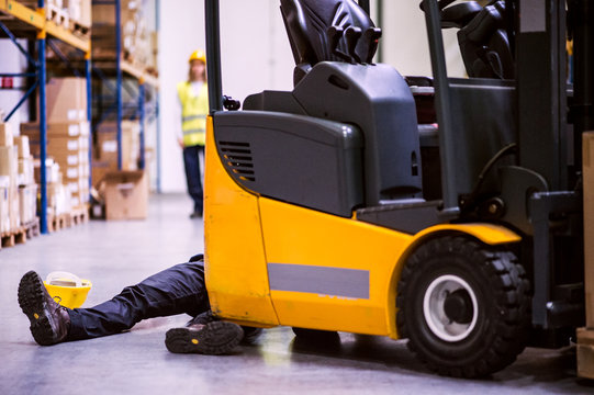 An injured worker after an accident in a warehouse.