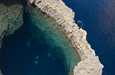 Snorkeler And Divers Near A Stone Arch, Malta