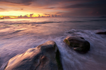 Sunset seascape at Kudat Sabah Malaysia. With natural coastal rocks and stunning sky.