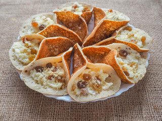 Traditional Arabic kataif crepes stuffed with cream, prepared for iftar in Ramadan
