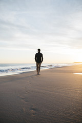 walking on beach at sunset - 192344172