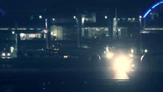 Aircraft preparing to take off at night with the lights switch on 
